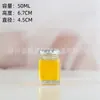 Venta al por mayor de fábrica botella de miel de vidrio gruesa blanca cristalina de alta calidad boca ancha botella cuadrada botella nido de pájaro Botella sellada para pepinillos