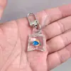 SHEIN TEMU Chaveiro Explosivo Peixe Dourado Transparente Peixinho Chaveiro de Resina Pingente de Joia Acessórios