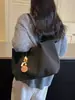 Bolso tejido retro 2026 de alta gama, nuevo diseño de moda, bolso de hombro de gran capacidad para ir al trabajo, bolso tote para debajo del brazo, estilo popular