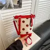 Bolso cubo de moda de lunares transfronterizo, bolso de hombro versátil y elegante estilo coreano para el uso diario y el trabajo, bolso cruzado de color block de nicho