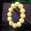 Pulsera de Cera de Abeja Ámbar de Segunda Generación Venta al por Mayor de Fábrica Ámbar Sangre Ámbar Flor Ámbar Medicina Pulsera de Cera Vieja Fluorescente Flotante Agua Salada