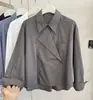 Nueva camisa versátil irregular estilo coreano para mujer, primavera temprana 2026, top chaqueta de manga larga de diseño de alta gama, moderno
