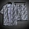 Comércio exterior à vista camisa floral havaiana masculina manga curta solta tamanho grande conjunto de praia casal estilo Hong Kong retrô moderno shorts