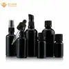 Botella de vidrio negro oscuro con bomba de presión, cabeza de goma dispensadora de emulsión, tapón de rosca gotero, botella redonda negra para aceite