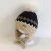 Bonitos y adorables gorros de otoño e invierno para niños, con diseño de poner, material de punto y una serie de dibujos animados, que brindan abrigo y protección para los oídos para bebés y niños pequeños.