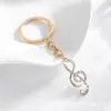 Hermosa forma de nota musical colgante para coche cadena de llaves colorida creativa adornos para bolso pequeños regalos al por mayor