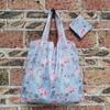 Bolsa de almacenamiento portátil para supermercado de exportación en stock mediana bolsa de compras bolsa de protección ambiental bolso de mano bolsa de compras plegable nailon