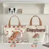 Nueva Bolsa de Lona Estilo Dibujo Animado Linda Gatito Bolso de Mano para Estudiante Versátil de Verano Ropa de Trabajo Bolsa de Gran Capacidad