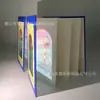 Carimbo de projeção de transmissão de luz este relógio de atração turística personalizado Taicang cenário de filme capítulo documento de desembaraço aduaneiro livro livro de luz e sombra