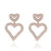Moda europea y americana textura de alta gama pendientes de plata S925 pendientes de doble amor temperamento versátil pendientes largos de corazón