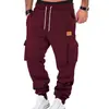 Deseo comercio exterior primavera y otoño deportivo versátil bolsillo etiqueta de cuero ropa de trabajo cordón pantalones jogger ropa de hombre al por mayor