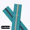 En stock No. 5 cremalleras de metal falso con dientes dorados, cremallera de resina recubierta, bidireccional dorado claro con base negra, cremallera de dientes de cobre falso