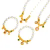 Puzuo Ouro de Areia Design Original Zircônia Trevo de Quatro Folhas Coração do Oceano Pérola Placa Pulseira Tecida Colar Conjunto de Alta Gama