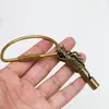 Pito de grifo de latón colgante para llavero de coche, collar con pito de supervivencia para exteriores para hombres y mujeres, colgante para bolsa