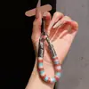 Correa de anillo superestilosa con bloques de color, duradera y resistente con un gancho de metal, un cordón para teléfono anti-pérdida para mujer para ir de compras