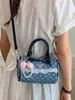 Bolsa Boston fofa estilo coreano com laço, bolsa de mão de bolinhas de nicho, moderna e na moda, bolsa de ombro fresca e doce
