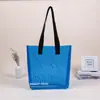 Bolso de mano de PVC con láser, bolsa de plástico transparente de TPU de colores, bolsa de compras de gelatina, bolsa de mano para regalo, se puede personalizar con impresión de logotipo