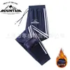 Pantalones de chándal gruesos y cálidos con forro de forro polar, nuevos para invierno, unisex, con tres rayas, pierna recta, puños, moda casual, joggers