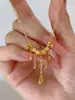 Collar Largo con Borla Ojo de Gato Dorado para Mujer Nuevo Estilo Chino Estilo Corte Diseño Lujo Ligero de Alta Calidad Cadena para Clavícula Otoño e Invierno