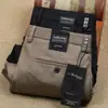 Pantalones casuales lisos de algodón elástico de fibra de poliéster grueso para otoño e invierno, de color sólido, para hombre, de oficina, de negocios, brillantes