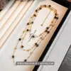 Collar de Ojo de Tigre de Doble Capa para Mujer Nuevo Estilo 2026 Lujo Ligero Nicho Gama Alta Estilo Francés Cadena Larga para Suéter Venta al por Mayor