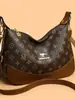 Bolsa de Dumpling Vintage Canguro 2026 Nueva Moda Versátil Bolso de Hombro Cruzado para Mujer Gran Capacidad Bolso para Mamá de Mediana Edad
