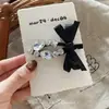 Pinza para el pelo de pato con lazo negro de pedrería, estilo nuevo coreano 2026, pinza de moda para flequillo, pinza lateral, accesorio para el pelo para mujer