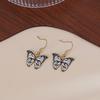 Europa y Estados Unidos ventas calientes transfronterizas personalidad creativa aretes de mariposa versión coreana simple Joker temperamento aretes de gota de aceite al por mayor mujeres