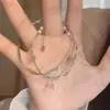 Pulseira feminina com design rabo de peixe, doce, camada dupla empilhada, pulseira Möbius de nicho com personalidade que combina com tudo e temperamento.