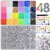 Caja de 24 compartimentos moderna y popular de diamantes de resina jelly de color AB con base plana, empaquetada para arte de uñas DIY, accesorios pequeños, venta al por mayor