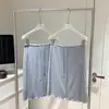Falda corta casual de verano para mujer, estilo coreano, gris suave, con cordón, cintura elástica, línea A, cola de pez, con dobladillo fruncido