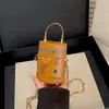 Mini bolso cilíndrico transfronterizo para mujer, nuevo bolso tipo cubo de hombro personalizado, bolso bandolera con cadena para lápiz labial y monedero