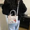 Bolso de mano pequeño dulce y lindo para niñas, nuevo modelo 2026, bolso tipo cubo simple para llevar en la mano, bolso cruzado versátil de verano