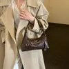 Bolso de hombro individual versátil y exquisito de moda transfronteriza, nuevo estilo 2026, bolso cruzado casual de color liso de moda, bolso de mano para ir al trabajo
