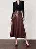 Ropa para mujer transfronteriza al por mayor: Colección de principios de otoño 2026, faldas midi populares para mujer con dobladillo acampanado