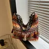 Bolso Casual de Lona con Borlas de Estilo Étnico de Moda de Gran Capacidad 2026 Nuevo Bolso Tote Versátil para Hombro y Cruzado