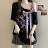 Camiseta de Manga Corta con Lazo Estéreo Off-Shoulder Talla Grande para Mujer Verano 2025 Nuevo Look Holgado Adelgazante y Cubre-Piel Top de Moda