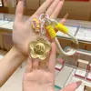 Llavero Dorado Oro Puro 999 Cadena para Teléfono Móvil Colgante de Bolso con Dinero para Gastar Año Nuevo Regalos Pequeños Culturales y Creativos Venta al por Mayor