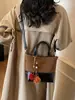 Bolso de Cubo Retro Simple Elegante Casual para Mujer Textura Diseño Nicho Bolso de Hombro Otoño e Invierno 2025 Bolso Cruzado