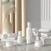 Em Estoque Novo Conjunto de Frascos de Porcelana Branca 120ml com Cabeça de Bomba de Pressão, Frasco para Loção, Cosméticos Pote de Creme Curto e Largo 50g Atacado