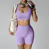 Nuevo conjunto de yoga transfronterizo: Shorts de fitness tipo durazno sin costuras que levantan los glúteos con almohadillas en el pecho, top deportivo y sujetador de yoga