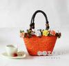 Atacado de fábrica 2024 nova bolsa de mão com flores coloridas bolsa de palha bolsa de flor de fada bolsa de praia bolsa tecida à mão