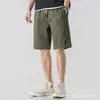 Marca moderna transfronteiriça microelástica verão jovem popular modelagem solta fashion cintura alta casual simples calça de cinco pontos calça de trabalho masculina