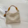 Bolso de Mano Tejido de Gran Capacidad 2026 Verano Nuevo Estilo Bolso de Hombro Personalizado Color Sólido Relajado Bolso de Playa para Vacaciones