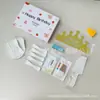 Conjunto de acessórios para bolo Fábrica Ningjin conjunto de sete peças em caixa velas de aniversário chapéu de coroa faca garfo prato de plástico descartável
