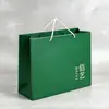 Bolsa de compras de papel recubierto con logo personalizado fabricante venta al por mayor verde oscuro estilo británico retro