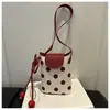 Bolsa de ombro vertical personalizada estilo coreano, nova para o verão de 2026, com estampa de bolinhas e retalhos, fresca, para trabalho e deslocamento, adequada para celulares e carteiras pequenas