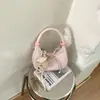Bolso de media luna de nicho estilo coreano, bolso de mano nuevo de un solo color con lazo, bolso cruzado casual y moderno para mujer al por mayor