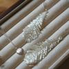 Pendientes de Borla de Pluma de Cisne Hechos a Mano con Cuentas Pendientes Largos Trenzados de Hada Pendientes de Lujo Ligero de Celebridad