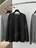 Yuran 26 Estilo Nuevo de Principios de Primavera Hilo Doble Teñido en Hilo Algodón Suave Etiqueta Metálica Raglán Holgado Recto Camisa de Manga Larga